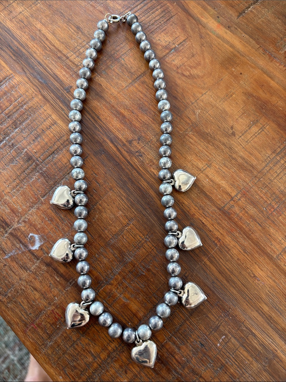 Silver beaded necklace with seven heart charms… From 80s